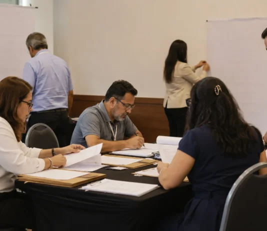 Propaganda intrapartidária nas Eleições 2026 tem prazo e limites Eleições 2026 com integrantes de partido organizando documentos para uma convenção interna.